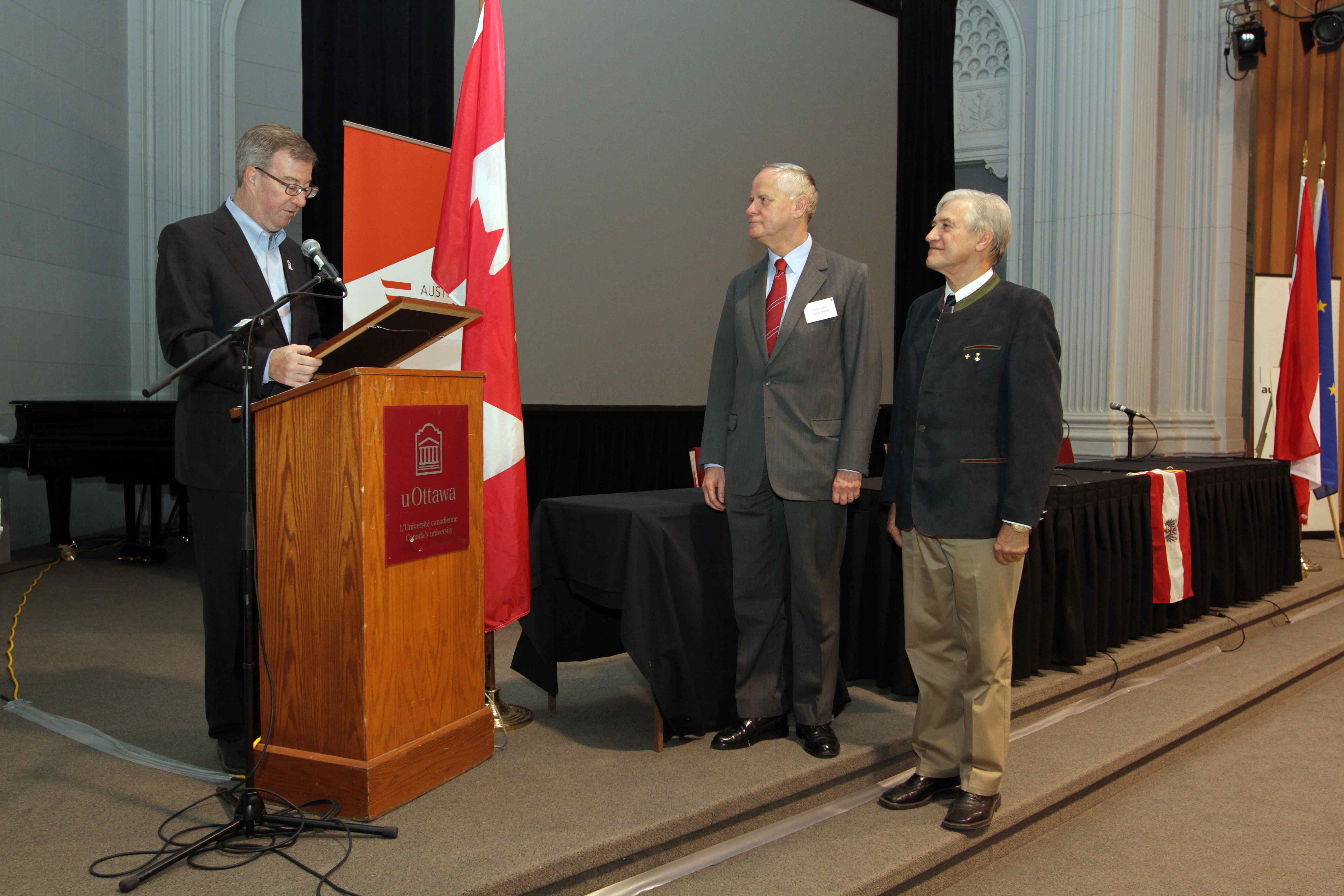 Mayor Watson reads proclamation while Amb. Riedel and ACC Pres. Pirker look on